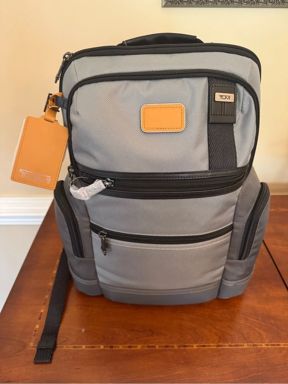 Tumi Gray Parrish Backpack with Black Trim and Tan Leather Tag